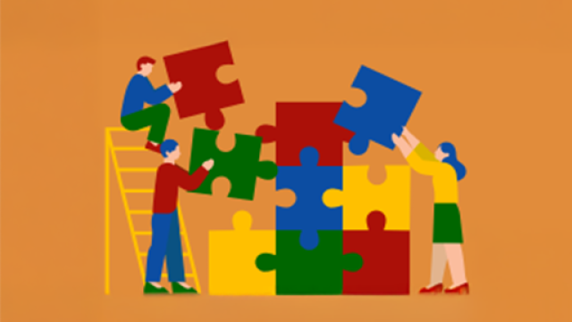 persone che costruiscono un puzzle