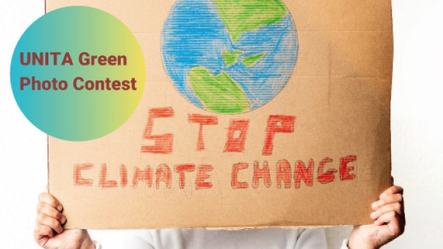 Contest fotografico UNITA - L'impatto del cambiamento climatico sul nostro ambiente cartello con disegno della terra e scritta: stop climate change