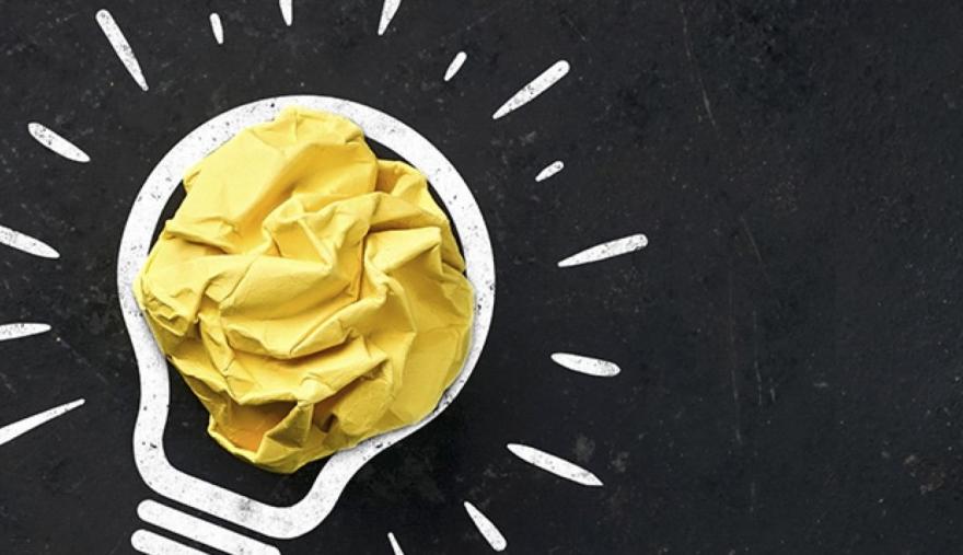 Progetto Microbiome Push - EIT Food La sagoma di una lampadina con all'interno un foglio giallo accartocciato