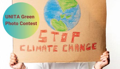 cartello con disegno della terra e scritta: stop climate change
