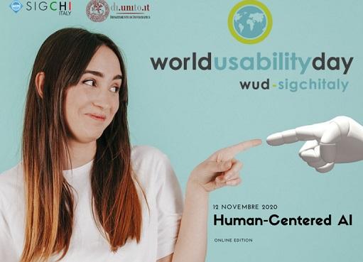 World Usability Day 2020 foto di una ragazza sorridente che tocca con un dito il dito di una mano robotica