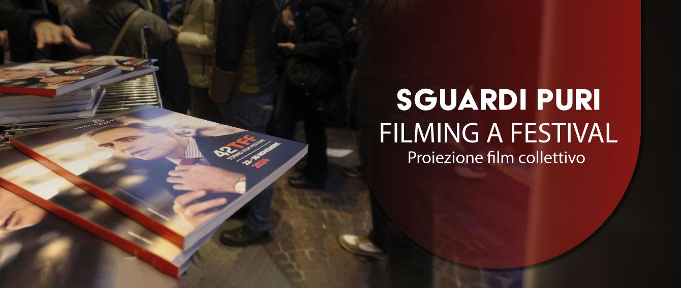 Fotografia di alcuni cataloghi del Torino Film Festival disposti su un tavolo.